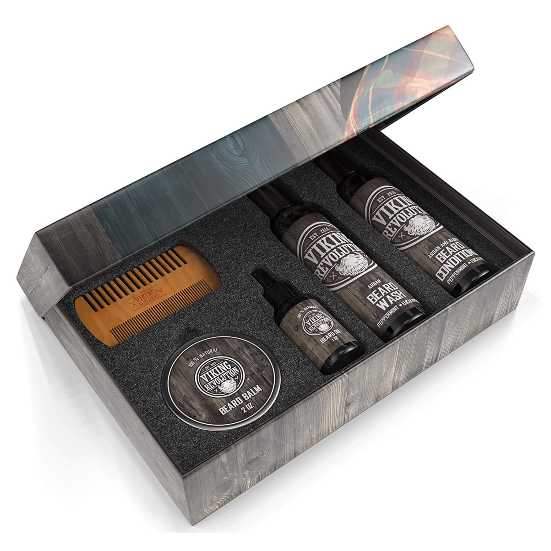 Beard Grooming Kit includes a selection of grooming essentials such as oils, balm, conditioner, shampoo, and a wooden comb, all infused with a soothing sandalwood scent, presented in a branded box.