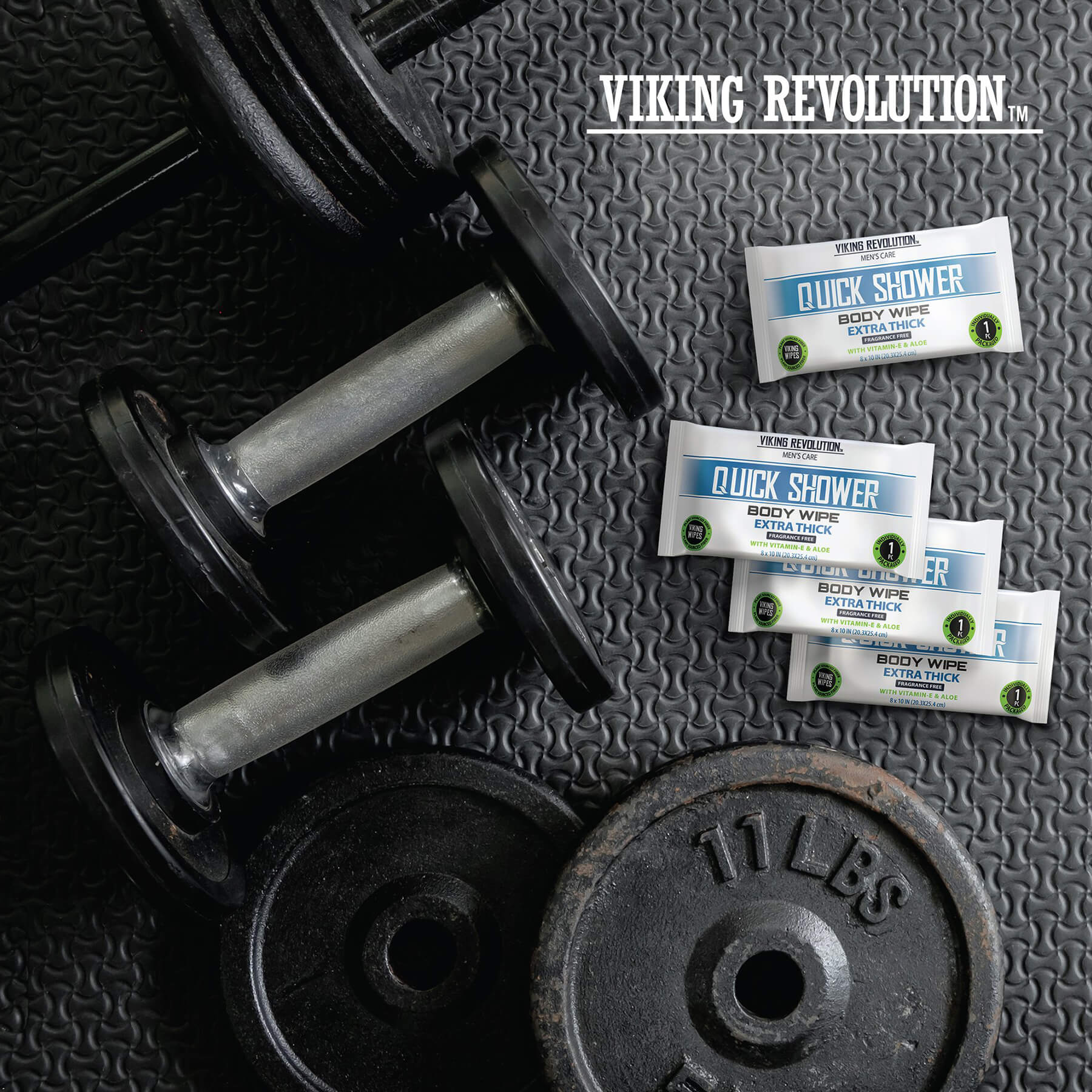 Dumbbells and weights on gym mat with Body Wipes w/ Vitamin E & Aloe - 12 Pack.