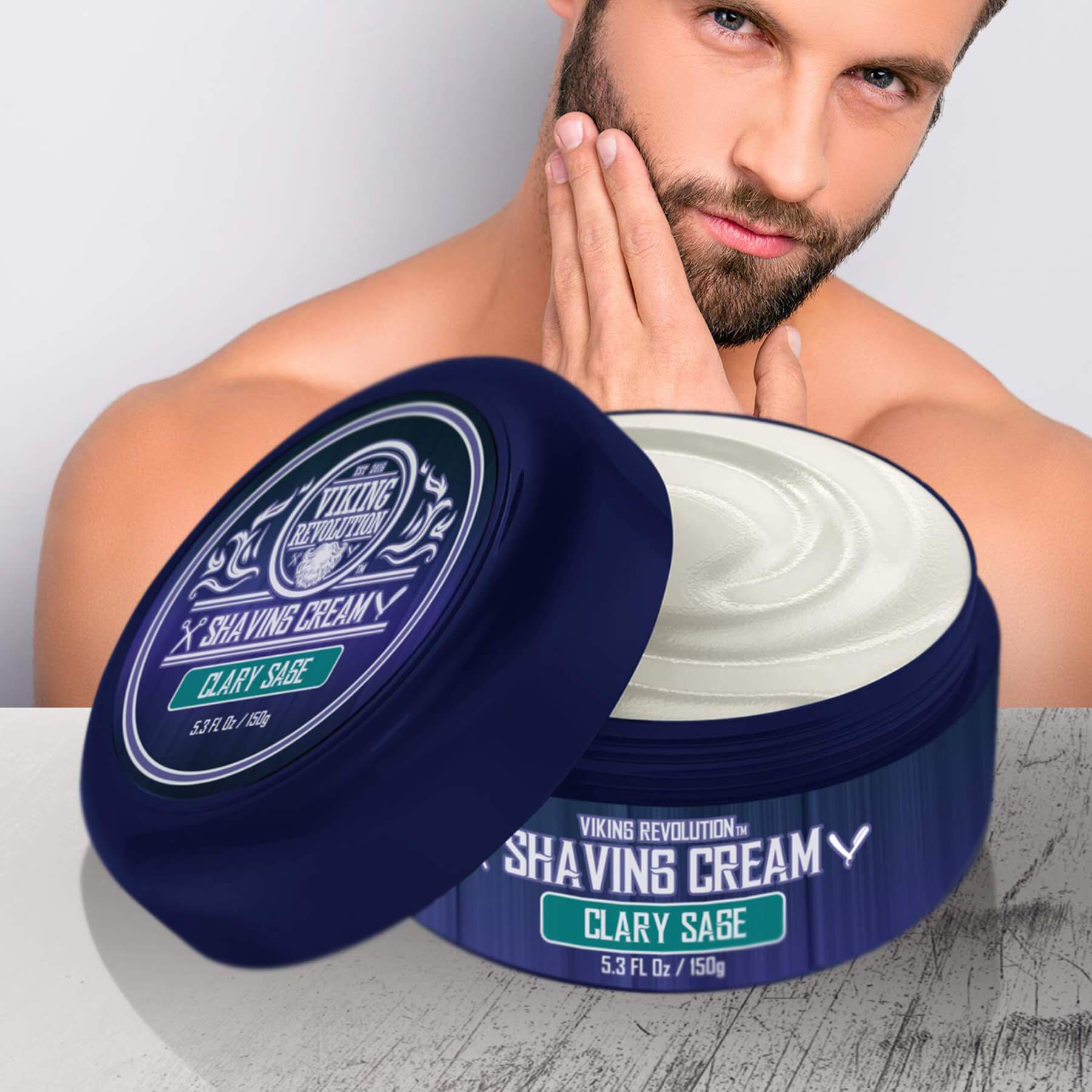 Man with beard touches his face by open container of Shaving Cream by Viking Revolution for smooth shave.