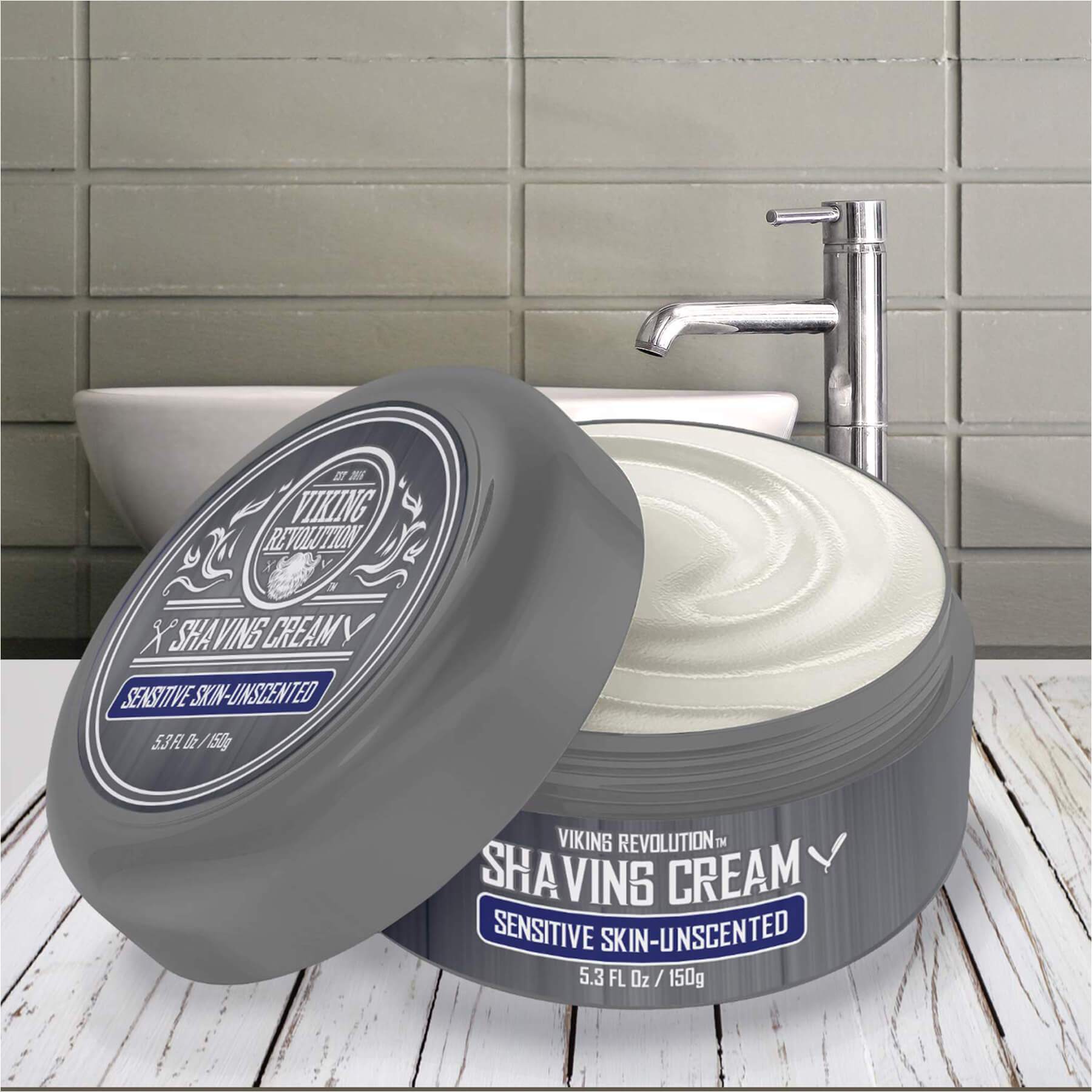 Unscented sensitive Shaving Cream in a bowl on a wooden surface by a faucet for a smooth shave.