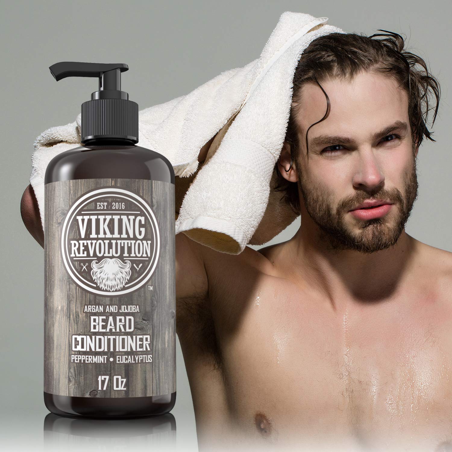 Man dries hair with towel next to Peppermint & Eucalyptus Beard Conditioner (17oz) for beard care.