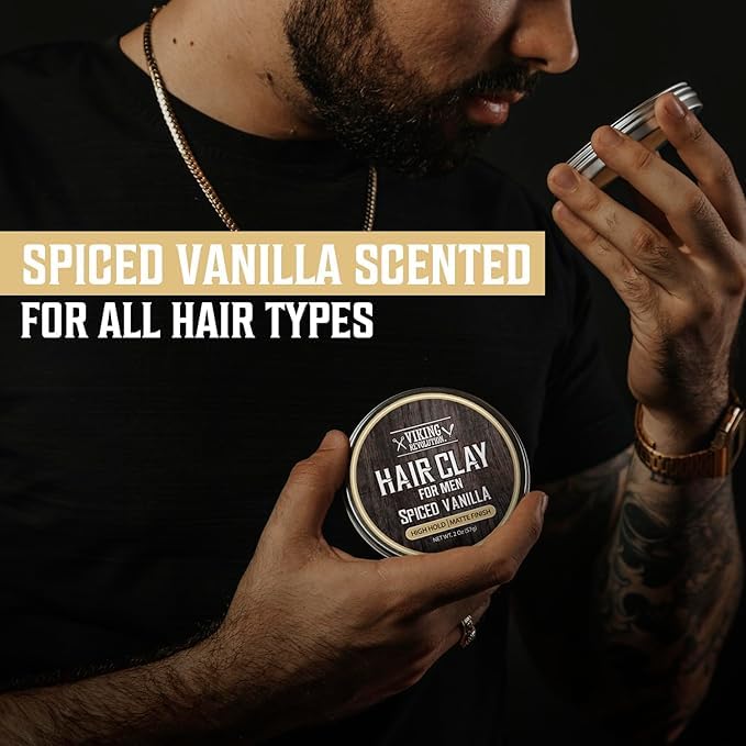 A man smells a 2oz tin of Hair Clay - Spiced Vanilla, a matte hair product for men.