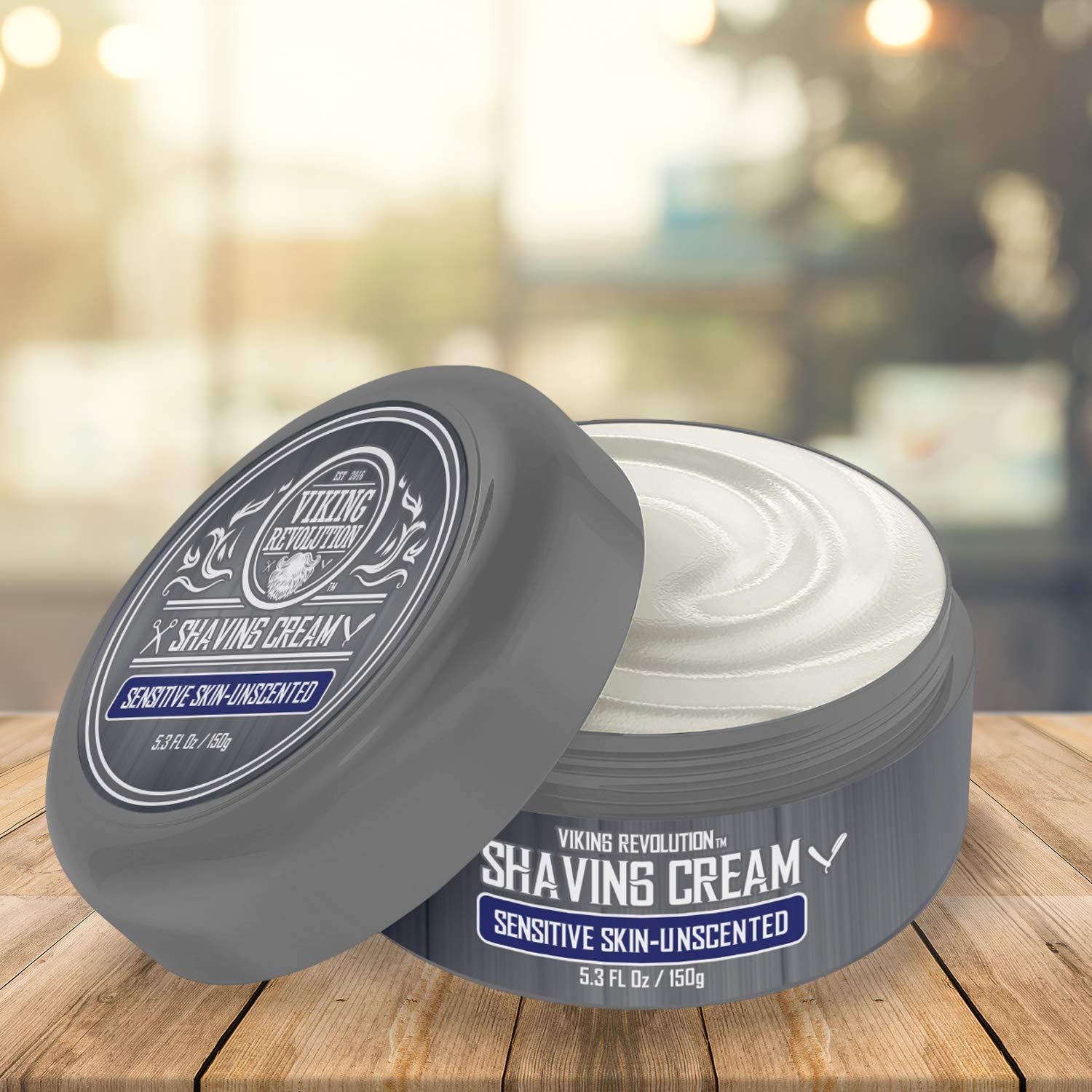 Open gray container of Unscented Shaving Cream for Sensitive Skin (5.3 fl oz) on wood surface.