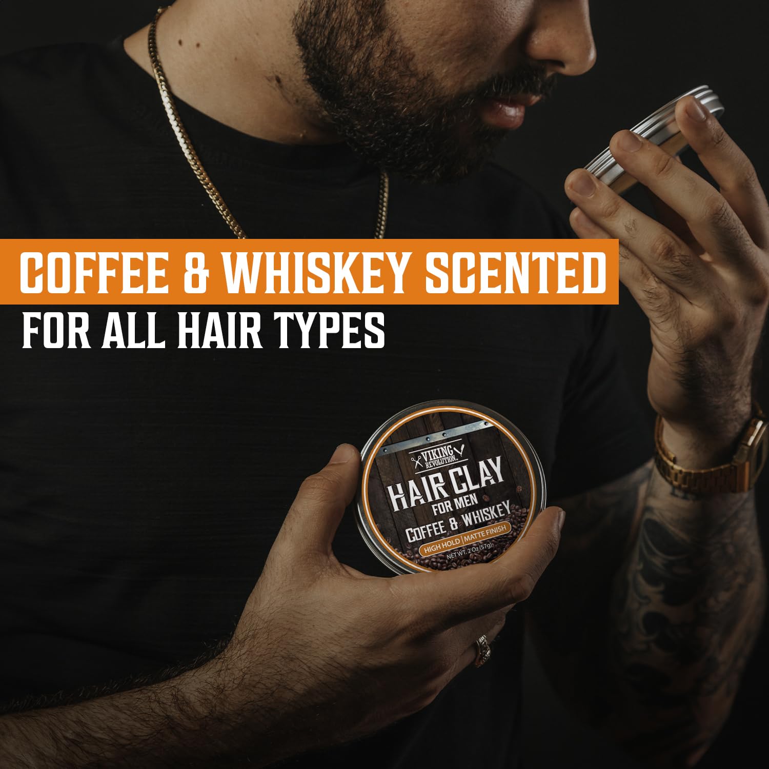 Man smelling a tin of Hair Clay - Coffee & Whiskey, labeled for all hair types.
