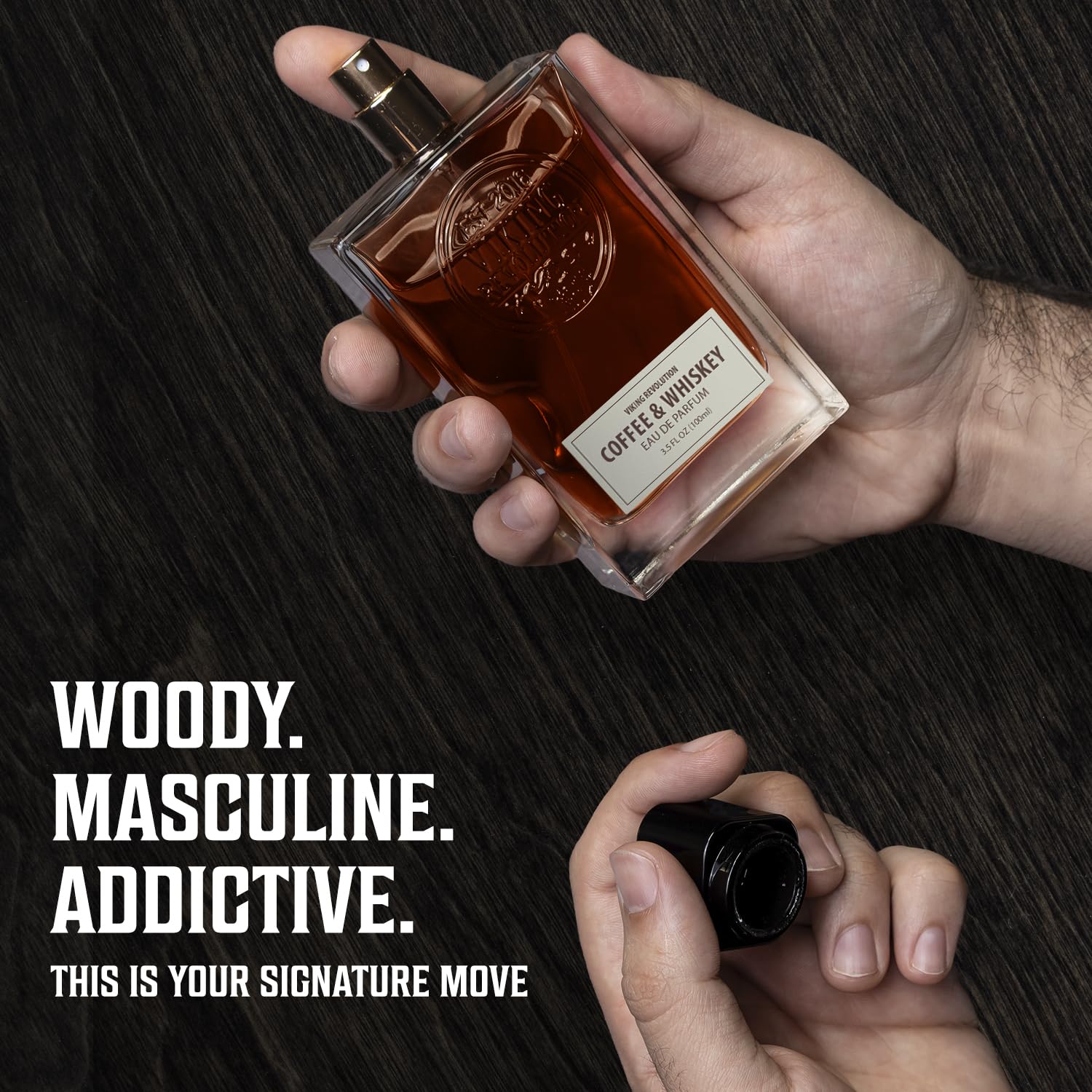 A hand sprays Coffee & Whiskey Perfume (3.5 fl oz); bold text reads Woody. A bold, addictive scent.