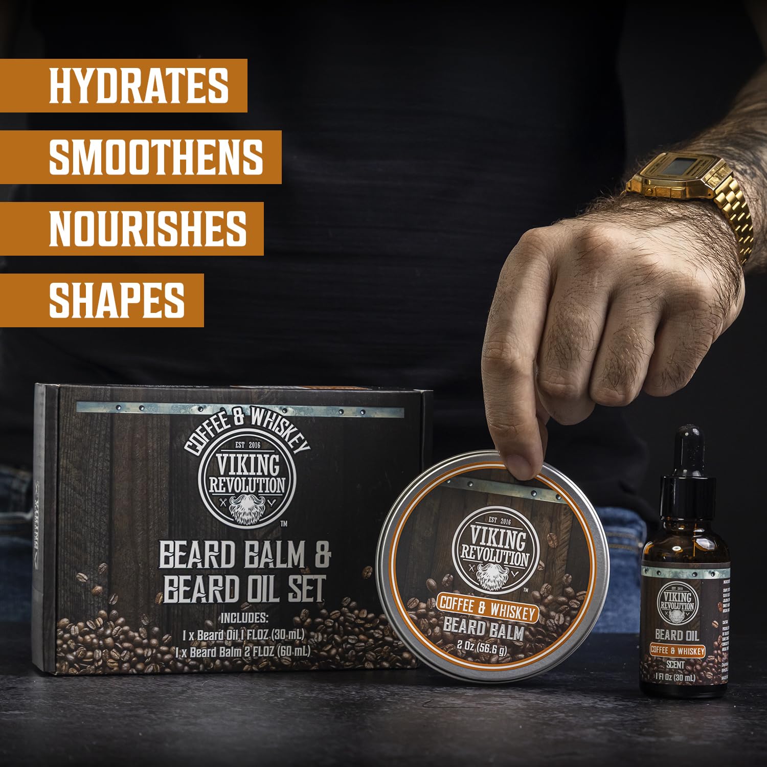 A hand holds Coffee & Whiskey Beard Balm and Sandalwood Beard Oil kit—a beard care essential.