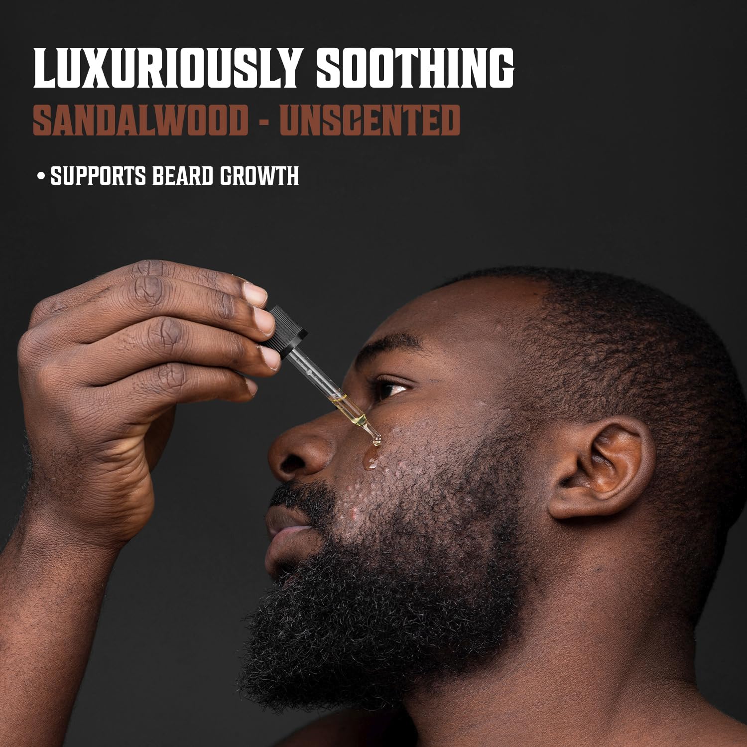 Man applying Sandalwood & Unscented Beard Oil - 2 Pack, supports beard growth and soothes.
