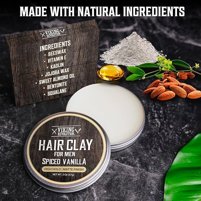 Open tin of Hair Clay - Spiced Vanilla (2oz) for men, with almonds, powder, and oil displayed nearby.