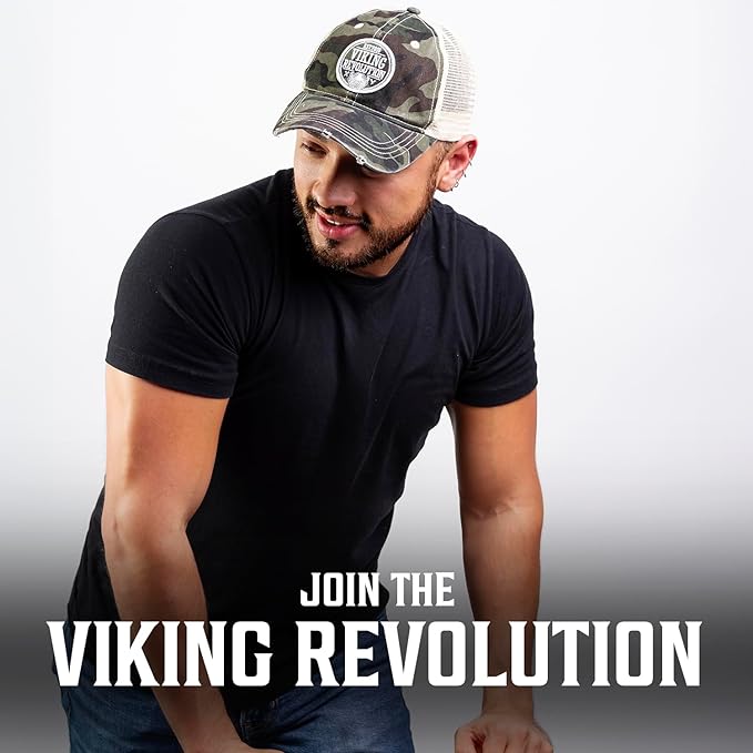 A man in a black shirt and a camouflage trucker hat, proudly showcasing the words JOIN THE VIKING REVOLUTION below.