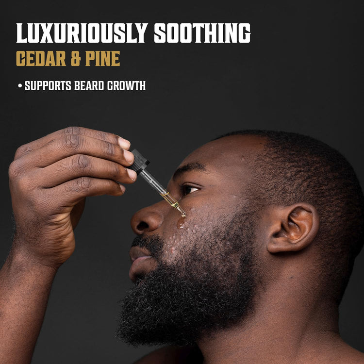 Man applying beard oil with a dropper; text reads Cedar & Pine Beard Oil - Luxuriously Soothing and infused with organic oils.