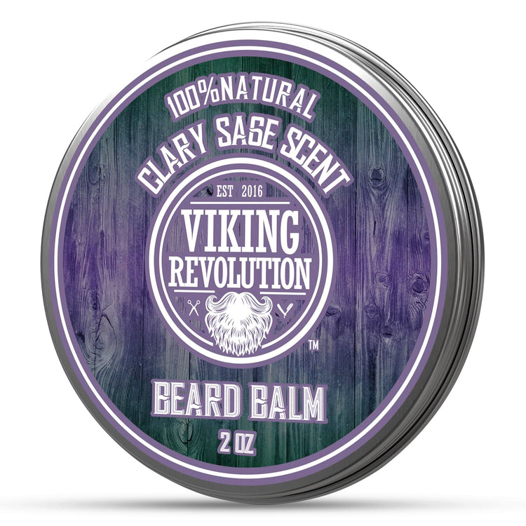 Round tin labeled Beard Balm by Viking Revolution, made with natural ingredients. The clary sage scent complements the purple and green rustic design, providing excellent beard conditioning.