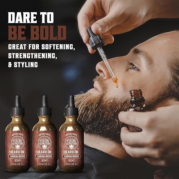 A man reclines while using a dropper to apply Sandalwood Beard Oil from the 3 Pack by Viking Revolution. This 100% natural beard oil, with its sandalwood scent, helps tame stubborn facial hair for a smoother, more manageable beard.