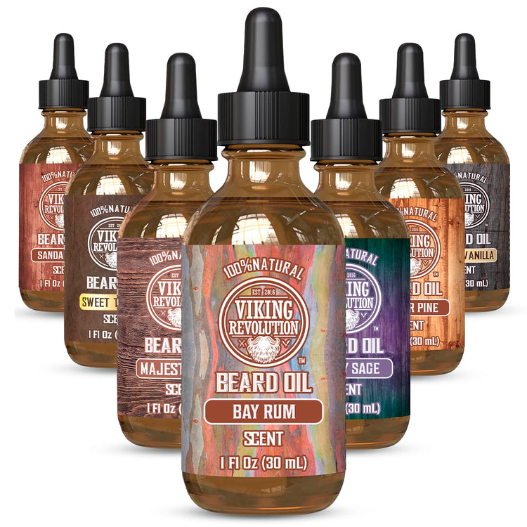 Seven bottles of Bay Rum Beard Oil from Viking Revolution, each in a distinct scent, meticulously arranged in a pyramid, provide the ultimate all-natural solution for superior beard maintenance.