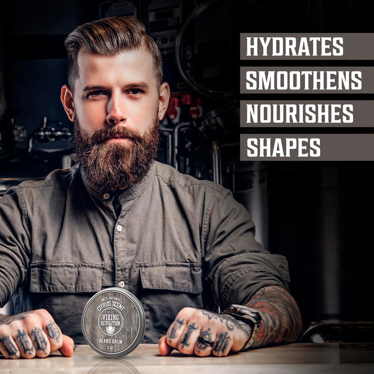 Man with tattoos showcasing Citrus Beard Balm that hydrates, smooths, nourishes, and shapes.