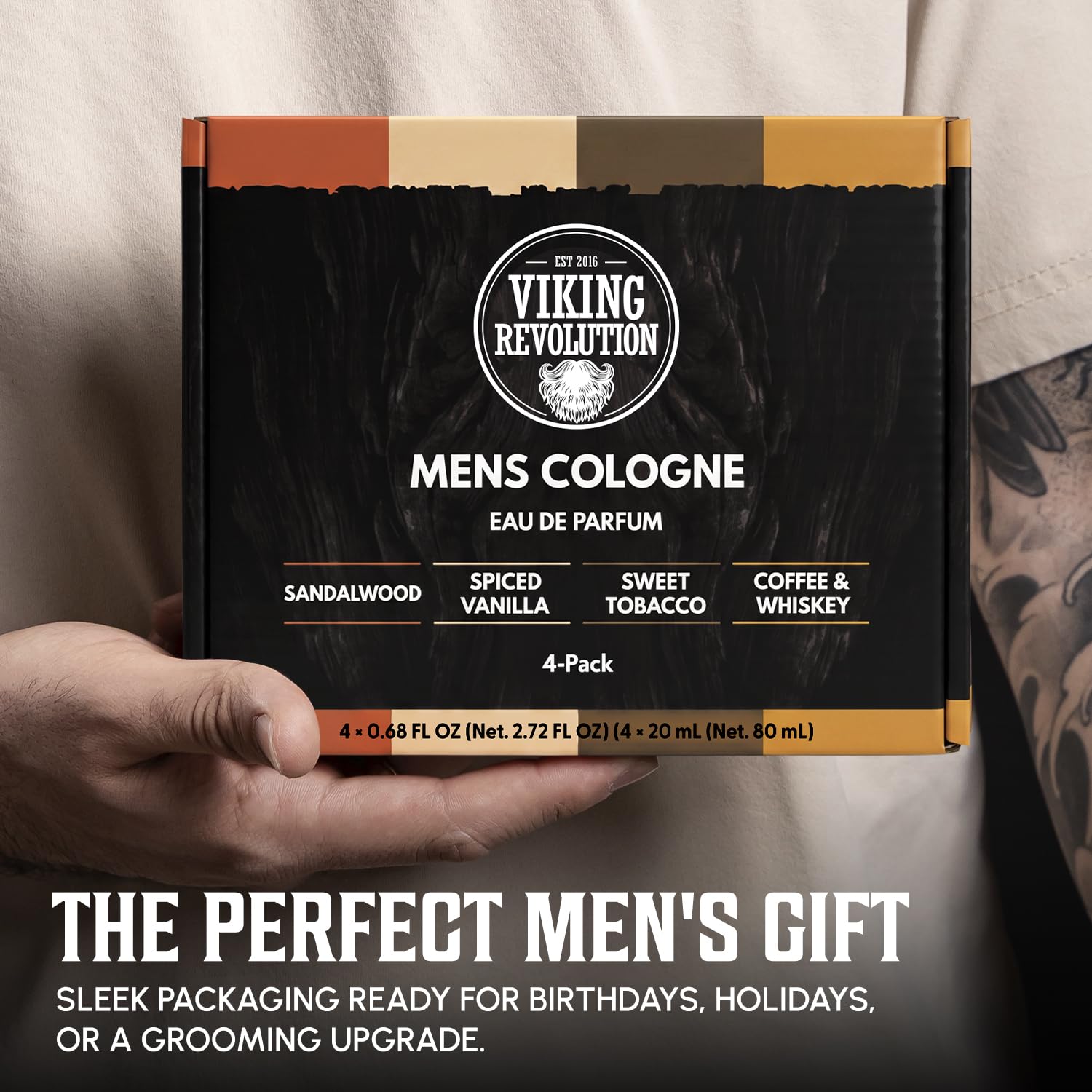 A person holds a men's Travel Size Cologne Gift Set—Sandalwood, Vanilla, Coffee & Whiskey scents.