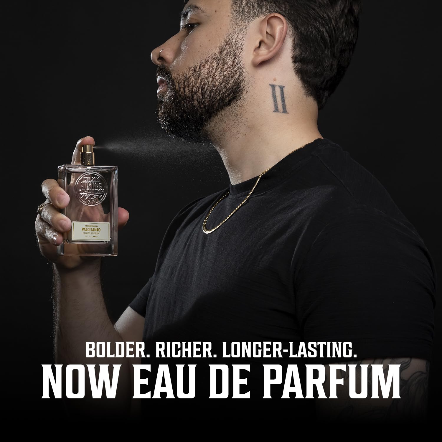 Man sprays fragrance; text: Bold. Rich. Palo Santo Eau de Parfum 3.4 Fl Oz—now for men.