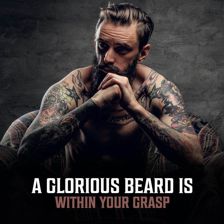 A tattooed man with a beard sits thoughtfully in a chair; the text reads, Unlock the Glory of Your Beard. Achieve it effortlessly with our all-natural Bay Rum Beard Oil for superior beard maintenance.