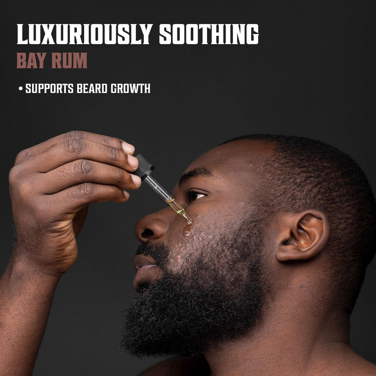 A man applying beard oil with a dropper; text reads Luxuriously Soothing Bay Rum Beard Oil - Supports Beard Growth with All-Natural Ingredients.