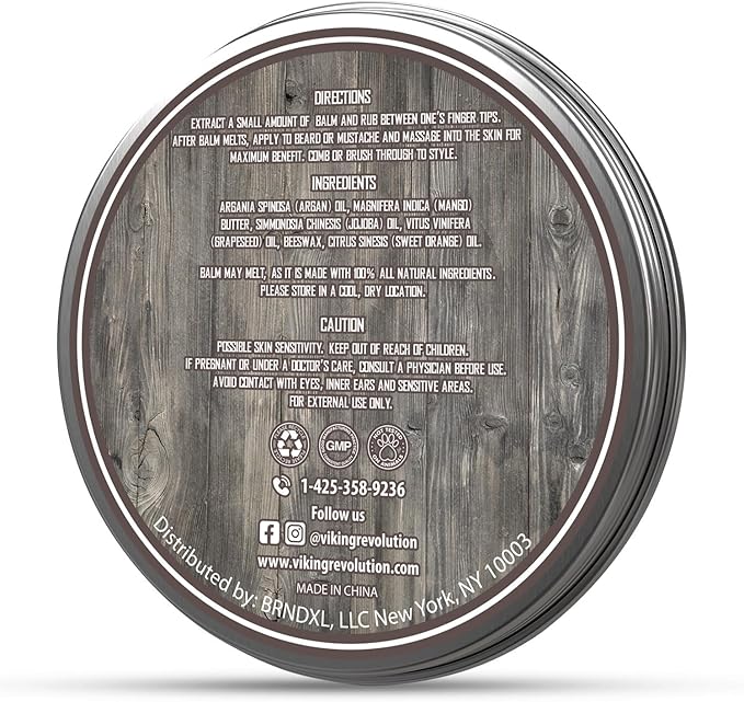 A jar of beard balm displayed on a wooden surface features instructions, ingredient list, and caution notes. Ideal for complementing your Beard Growth Kit to help you attain that desired appearance.