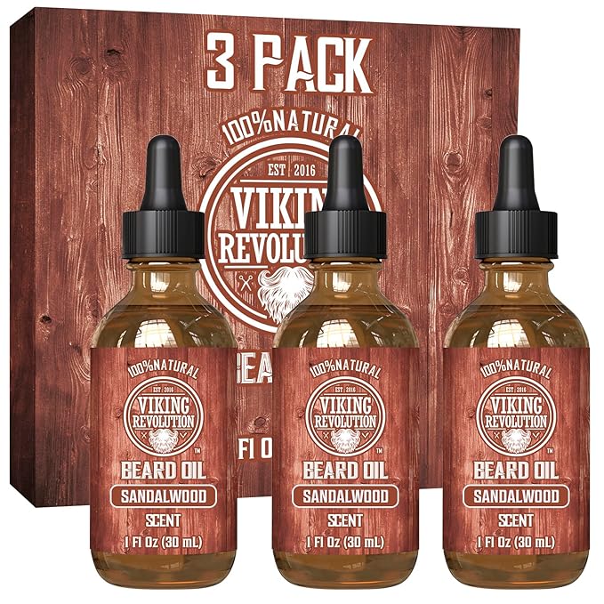 In front of the packaging are three bottles of Sandalwood Beard Oil - 3 Pack, celebrated for its 100% natural formulation.