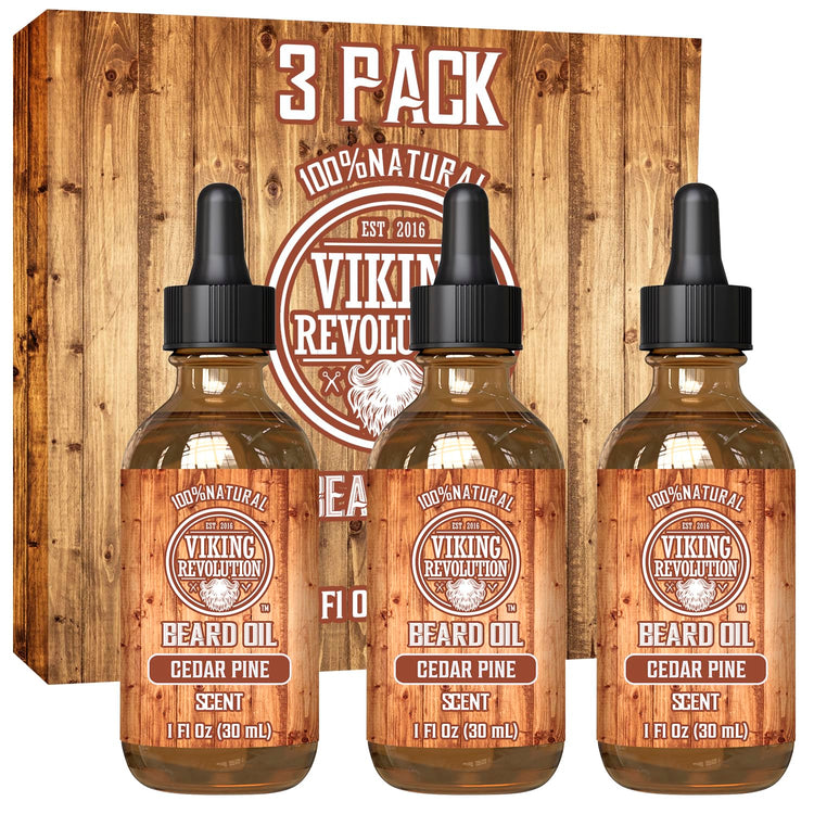 Three bottles of Cedar & Pine Beard Oil - 3 Pack, designed with organic oils for premium care, are displayed in front of their packaging.