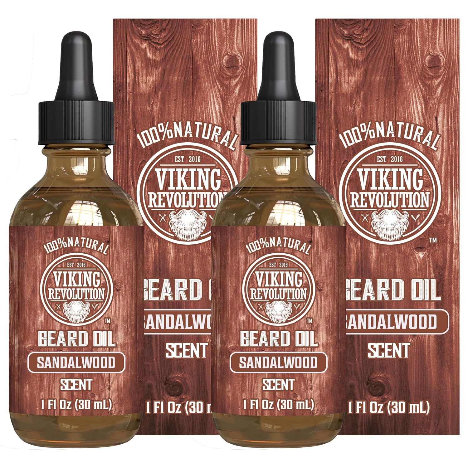 Two bottles of Sandalwood Beard Oil, renowned for its organic formulation, are neatly packaged in their boxes. This beard oil conditioner helps maintain a frizz-free beard, ensuring your facial hair remains smooth and well-tended with every use.