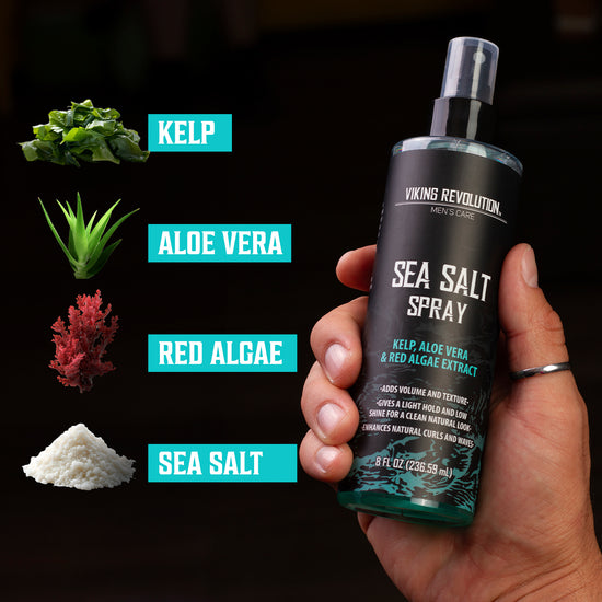 Hand holding a Sea Salt Spray for Hair Men bottle, with ingredients: kelp, aloe vera, red algae, and sea salt.