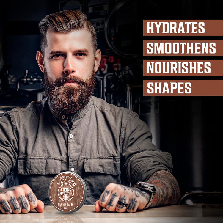 Tattooed man in workshop promotes Sandalwood Beard Balm; hydrates, shapes, and nourishes with natural ingredients.