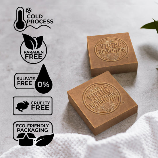 Two Cedarwood & Pine bars by Viking Revolution with natural labels, on towel with greenery.