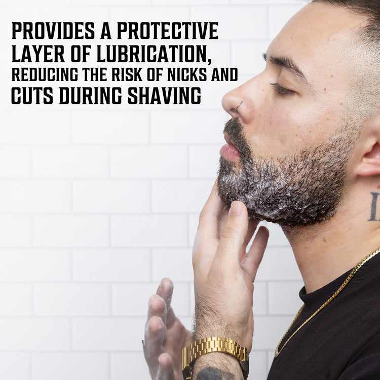 Man applying Viking Revolution Shaving Soap, noting lubrication benefits on white tile background.