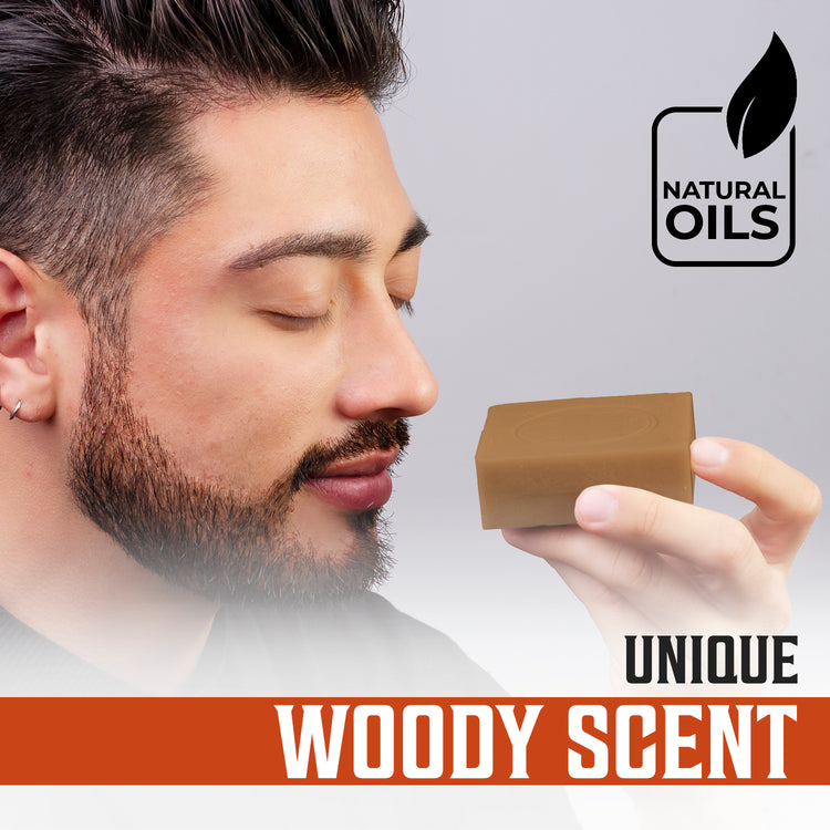 Man smelling Cedarwood and Pine Natural Soap for Men with Unique Woody Scent and Natural Oils text overlay.