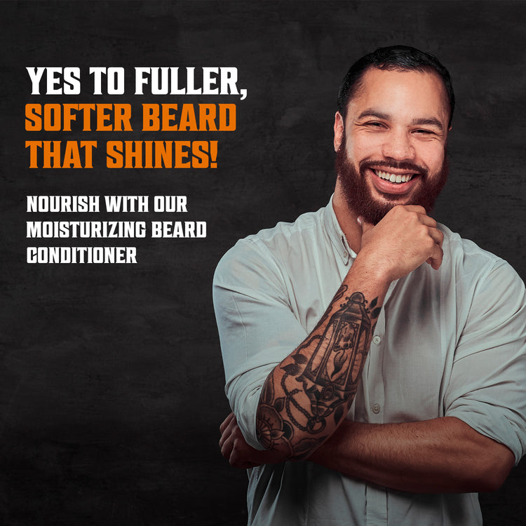 Tattooed man smiling, promoting Coffee & Whiskey Beard Wash and Conditioner Set for ultimate beard care.