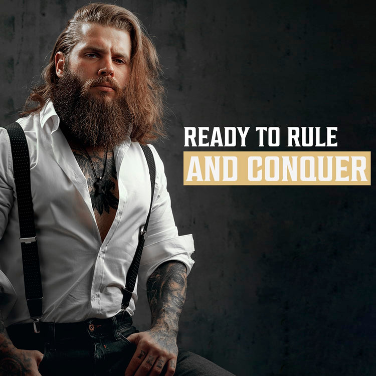 Man with long hair/facial hair, in suspenders, next to text: Ready to Rule with Palo Santo Beard Wash Set.