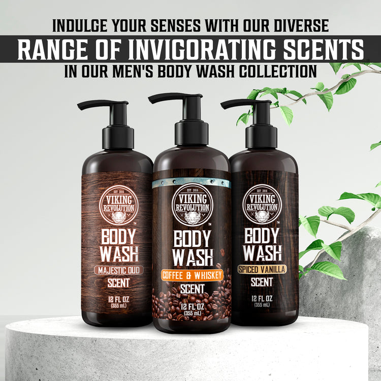 Three 12oz Coffee & Whiskey Body Wash bottles on marble with a plant backdrop.