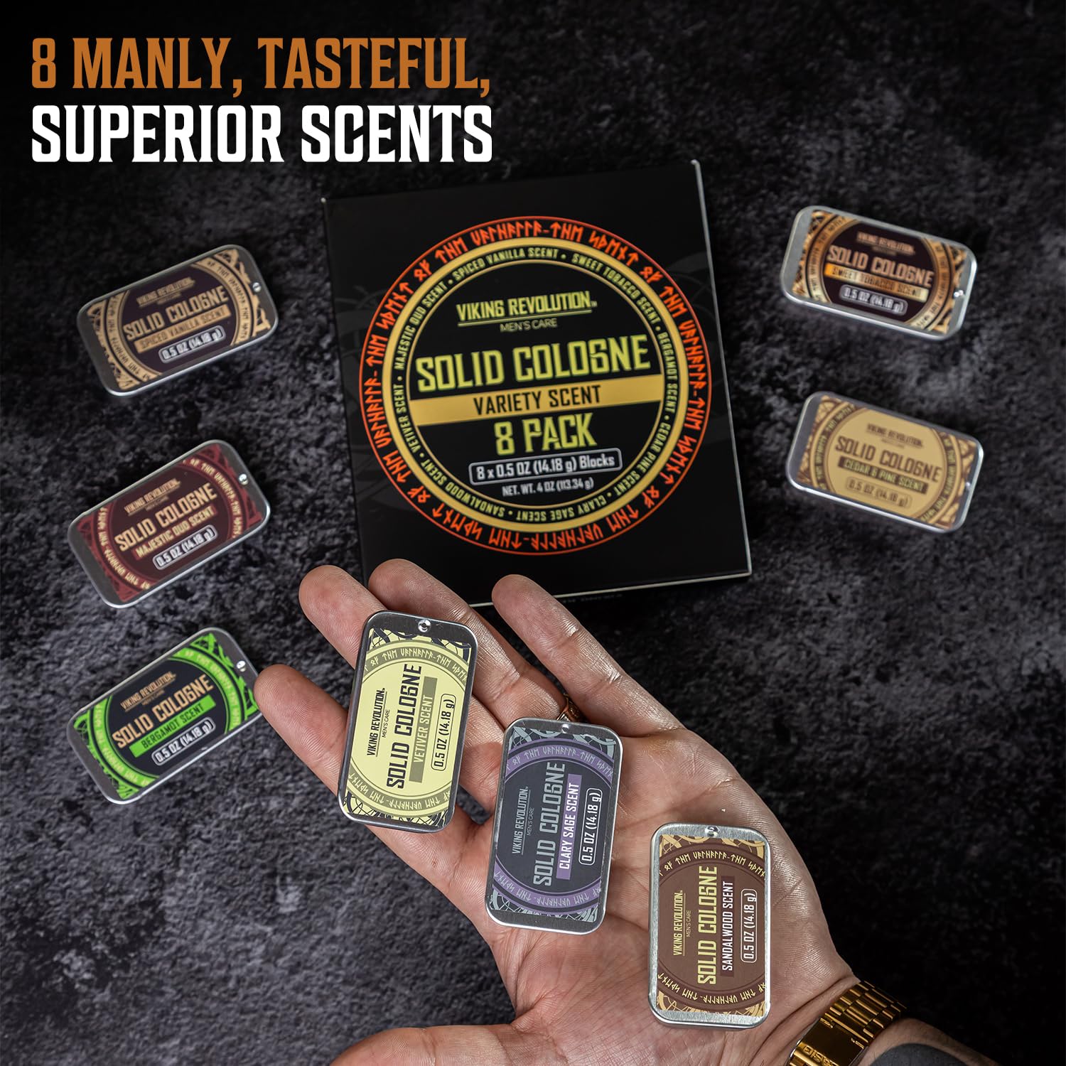 A hand holds the Solid Cologne 8 Pack; more tins and a gift box rest on a dark surface.