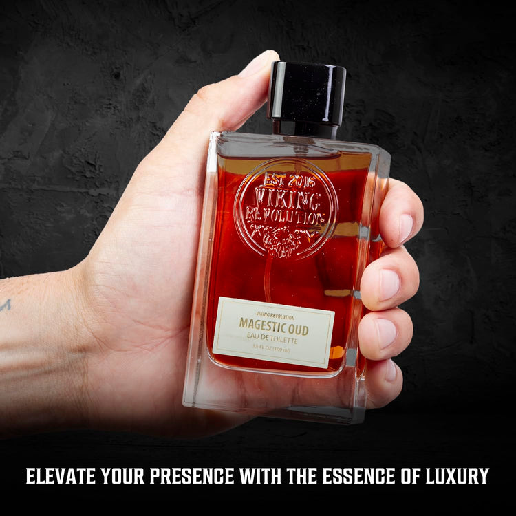 Hand holds a Majestic Oud Cologne for Men 3.5 Fl Oz against a dark backdrop.