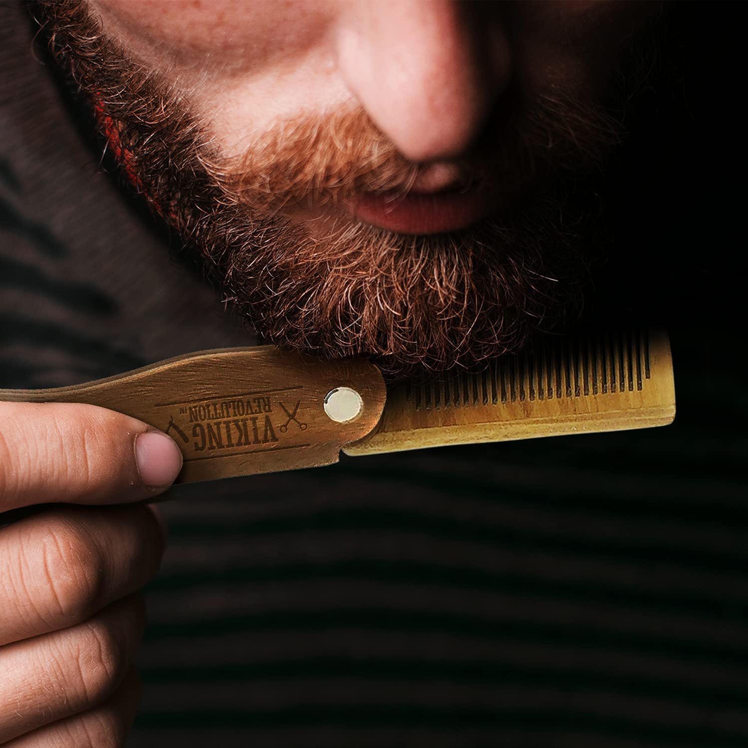 Close-up of a person gently combing their beard with the Folding Beard Comb w/Carrying Pouch, ensuring optimal beard grooming.