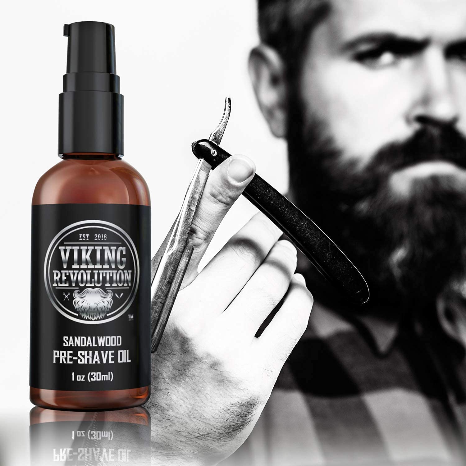 A man grips a straight razor, ready for a clean shave, as the Sandalwood Pre-Shave Oil from Viking Revolution sits prominently in the foreground.