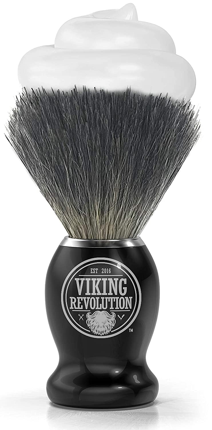 A luxurious wet shave is achieved with the Badger Hair Shaving Brush, featuring natural badger bristles and a sleek black handle labeled Viking Revolution, topped with a rich soap lather.