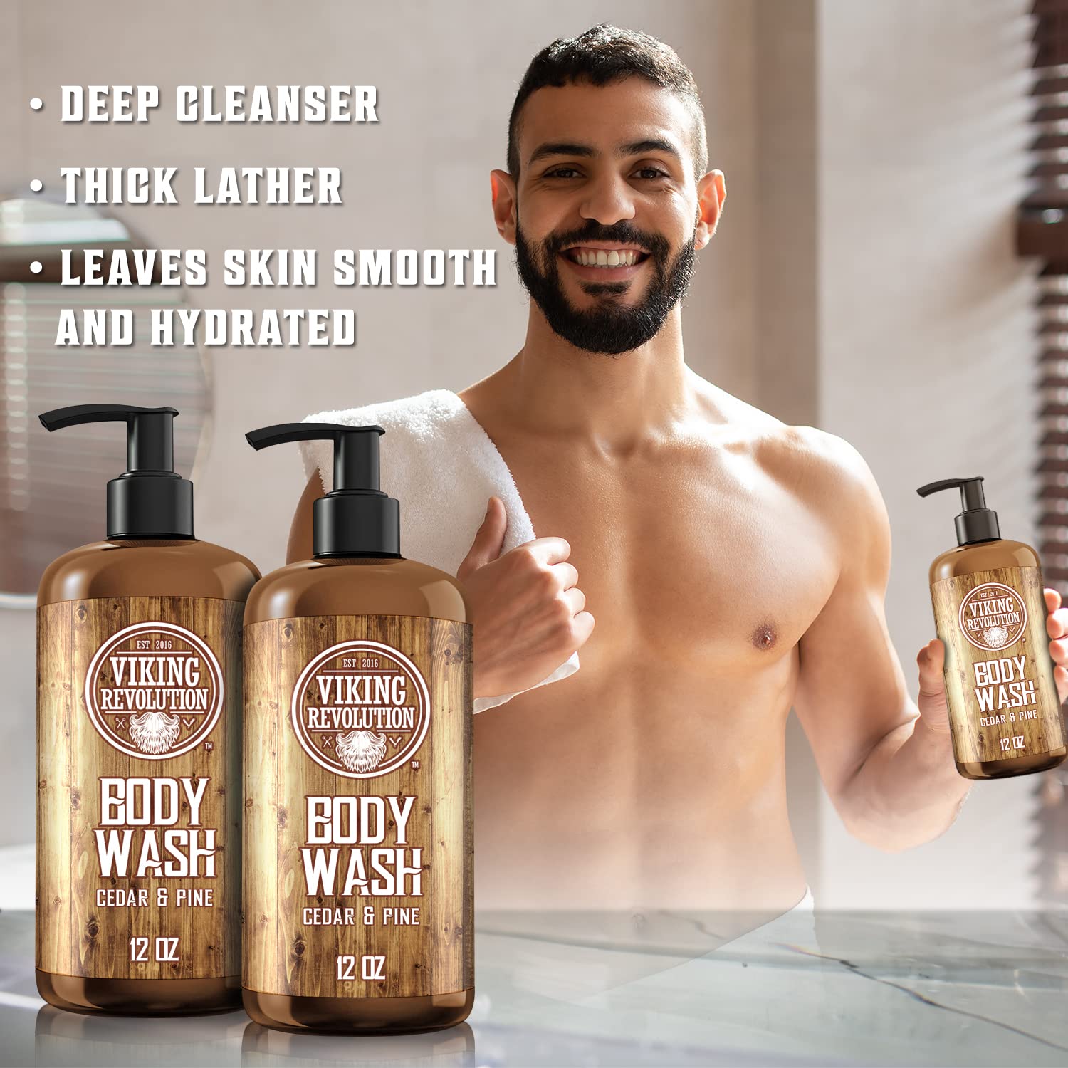 Active man with towel, smiling, holding Cedar & Pine Body Wash - 2 Pack from Viking Revolution.