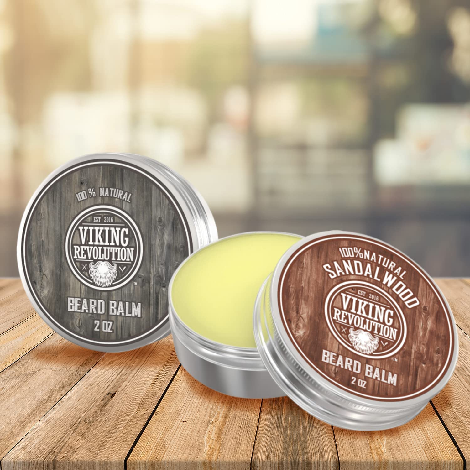 Two tins of Beard Balm - 2 Pack on wood, one open to reveal light yellow balm.