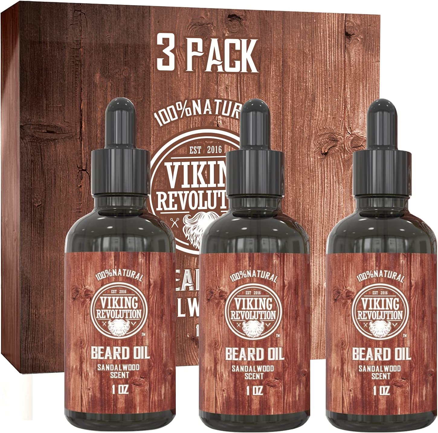 The Sandalwood Beard Oil - 3 Pack features three bottles infused with 100% natural ingredients and a soothing sandalwood scent, all packaged in a stylish wooden-patterned box designed to effortlessly tame stubborn facial hair.