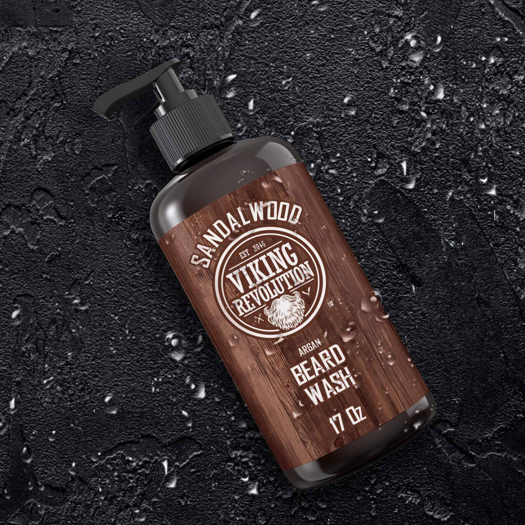 Viking Revolution Beard Wash 17oz with natural ingredients on a dark, textured surface.