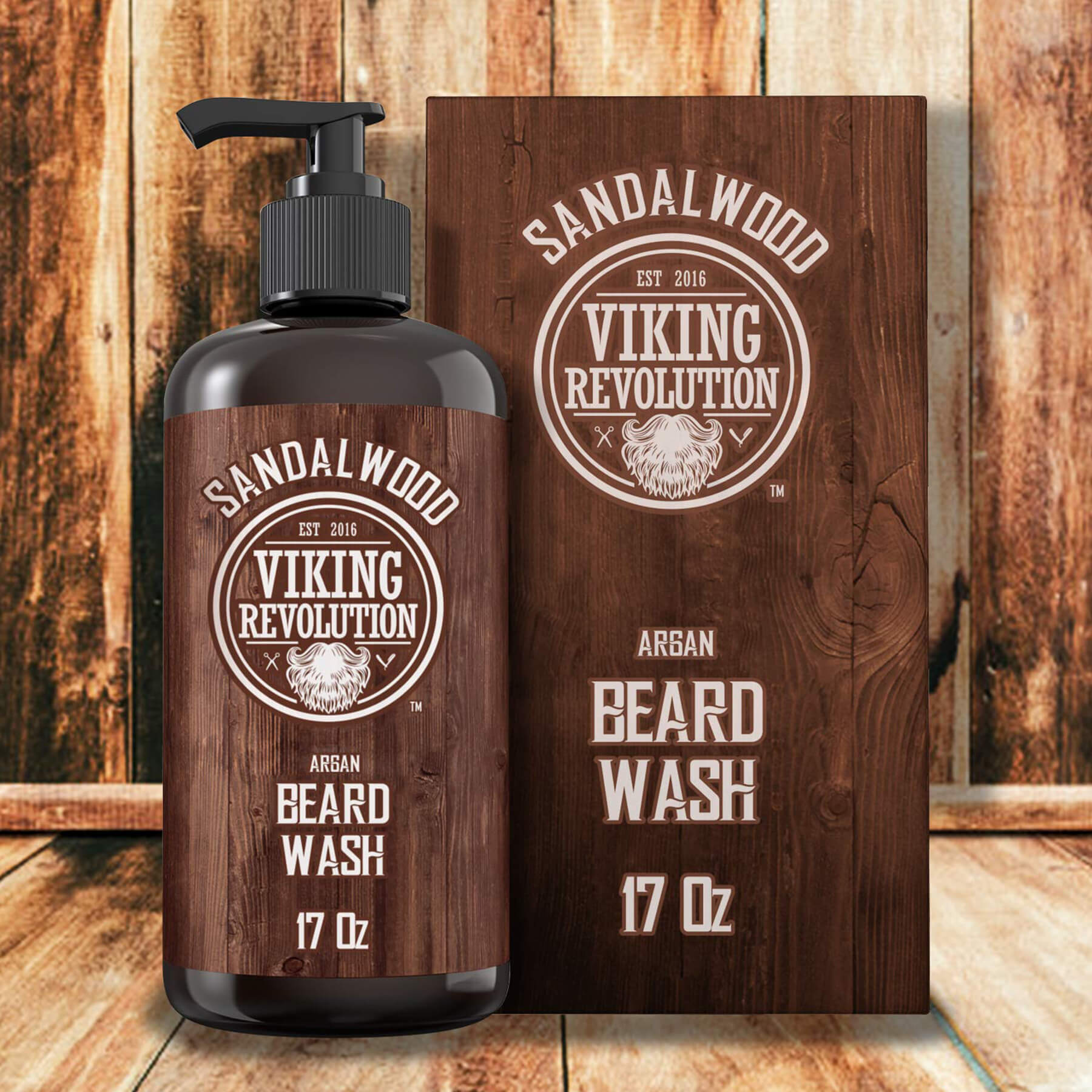 Brown bottle and box of Sandalwood Beard Wash 17oz on a wood background. This essential beard cleanser has a sandalwood scent that refreshes and invigorates your beard. Enjoy peace of mind with our satisfaction guarantee.