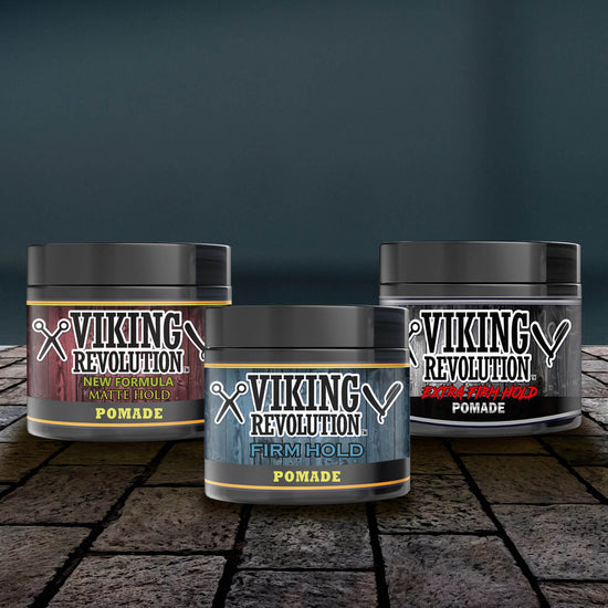 The three containers of the Hair Pomade Mix - 3 Pack by Viking Revolution elegantly rest on a stone surface, highlighting their matte hold suitable for any hairstyle.